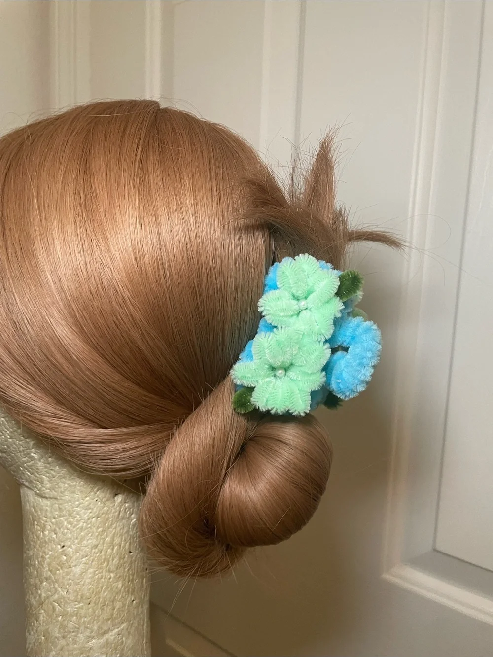 Handmade blue and green pipe cleaner floral hair clip